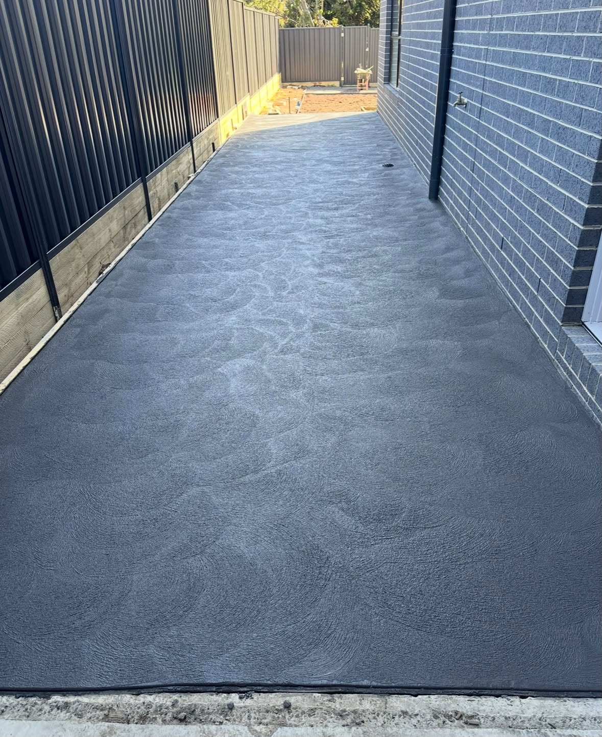 Freshly finished concrete pathway